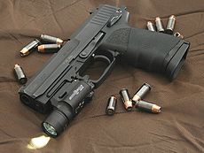 HK USP 45 surrounded by .45 caliber Hornady TAP (+P) jacketed hollow point rounds.jpg